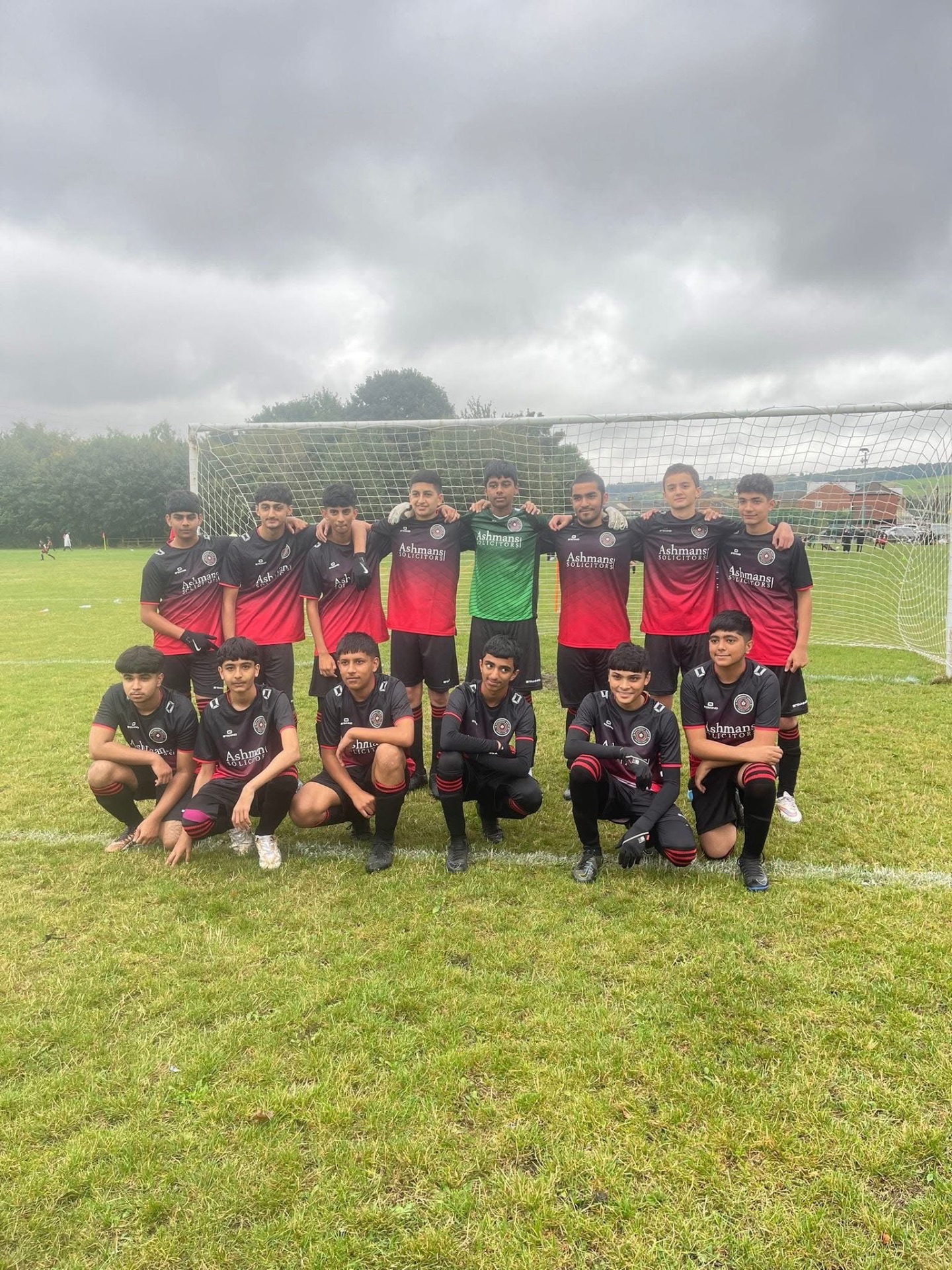 Dewsbury West FC team photo in front of the goal